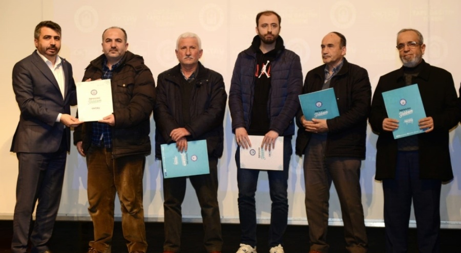 Bursa'da imar çalışmaları tamamlanan mahallelerdeki hak sahipleri tapularını aldı