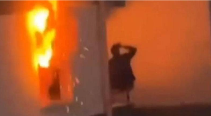 Evi alev alev yanarken, balkonda içki içmeye devam etti