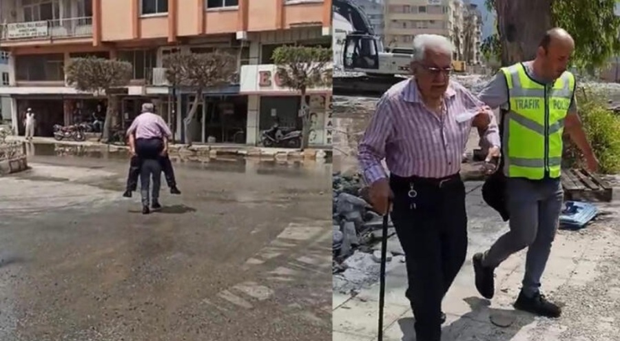 Hatay'da sel basan sahilde polis depremzedeyi sırtında taşıdı