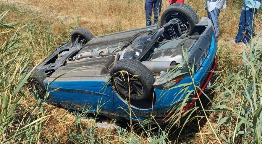 Takla atan otomobilden kurtuldu