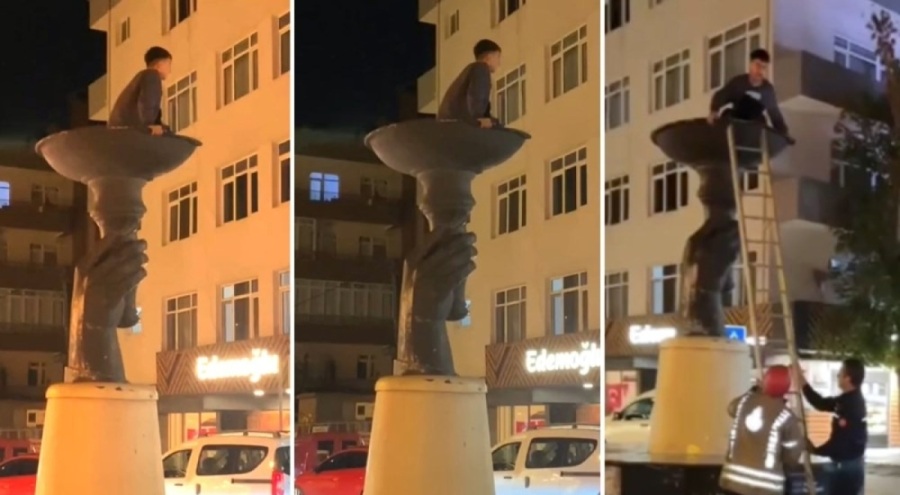 İddia için çıktığı heykelde mahsur kaldı