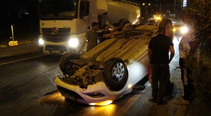Ters dönen araçtan burnu kanamadan çıktı